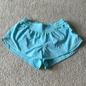 Lululemon Hotty Hot shorts low-rise 2.5 in. Color is Electric Turquoise.